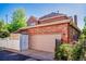 Attached two-car garage with neutral door, framed by a privacy fence at 693 Syracuse St, Denver, CO 80230