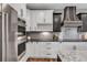 Modern kitchen featuring stainless steel appliances and stylish cabinetry at 693 Syracuse St, Denver, CO 80230