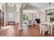 Open living area with hardwood floors and ample natural light at 693 Syracuse St, Denver, CO 80230