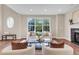 Cozy living area featuring a fireplace and large windows at 693 Syracuse St, Denver, CO 80230