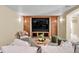 The cozy living room boasts built-in cabinets, a media center, and stylish decor at 693 Syracuse St, Denver, CO 80230