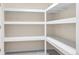The pantry features several layers of shelves for ample storage space at 693 Syracuse St, Denver, CO 80230