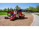 Community playground with colorful equipment and a shaded picnic area at 693 Syracuse St, Denver, CO 80230