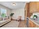 Cozy wet bar with custom cabinets, mini fridge, sink, and a comfortable seating area at 693 Syracuse St, Denver, CO 80230
