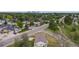 Neighborhood aerial shot, with tree-lined streets and the city skyline in the distance at 107 S Windsor Dr, Denver, CO 80219