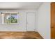Bright, light-filled room with hardwood floors and a large window offering pleasant views of the exterior at 107 S Windsor Dr, Denver, CO 80219