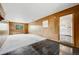 Spacious living room featuring wood paneling, contrasting flooring and window at 107 S Windsor Dr, Denver, CO 80219