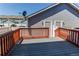 Outdoor deck offering a relaxing space with railing and privacy fencing at 19043 E 58Th Ave, Denver, CO 80249