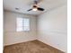 Neutral bedroom featuring a ceiling fan, window with blinds, and wall trim at 19043 E 58Th Ave, Denver, CO 80249