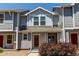 Charming two-story home with gray siding and a cozy front porch at 19043 E 58Th Ave, Denver, CO 80249