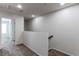 Carpeted hallway showing access to other rooms and stairs at 19043 E 58Th Ave, Denver, CO 80249