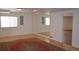 Finished basement featuring an area rug and mirror wall at 9232 Bauer Ct, Lone Tree, CO 80124