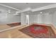 Finished basement with mirror wall and an area rug at 9232 Bauer Ct, Lone Tree, CO 80124