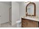 Bathroom with a vanity, stylish mirror, and a walk-in shower at 9232 Bauer Ct, Lone Tree, CO 80124