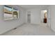 Bright bedroom featuring plush carpet, ample natural light, and walk-in closet at 9232 Bauer Ct, Lone Tree, CO 80124