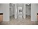 Spacious hallway leading to closets with built-in shelves at 9232 Bauer Ct, Lone Tree, CO 80124