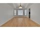 Dining room with tray ceilings, hardwood floors, and natural lighting at 9232 Bauer Ct, Lone Tree, CO 80124