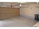 Garage features epoxy flooring with updated lighting and plenty of storage space at 9232 Bauer Ct, Lone Tree, CO 80124