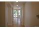 Hallway featuring arched doorways and hardwood floors at 9232 Bauer Ct, Lone Tree, CO 80124