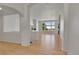 Bright, open-concept living room with hardwood floors, large windows, and a modern fireplace at 9232 Bauer Ct, Lone Tree, CO 80124
