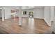 Open floor plan with hardwood flooring, a sink area, a walkout, and bright natural light at 9232 Bauer Ct, Lone Tree, CO 80124