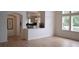 Spacious living room with hardwood floors and an arched doorway to the kitchen at 9232 Bauer Ct, Lone Tree, CO 80124