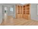 Home office with custom built-in shelving and hardwood floors at 9232 Bauer Ct, Lone Tree, CO 80124