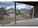 View from the patio to the homes across the street and their well-manicured lawns at 9232 Bauer Ct, Lone Tree, CO 80124