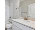 Bathroom with a single sink vanity, featuring quartz countertops, toilet, and shower at 457 Interlocken Blvd # 106, Broomfield, CO 80021
