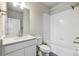 Bathroom featuring a shower and tub combo, a vanity, and white tile flooring at 457 Interlocken Blvd # 106, Broomfield, CO 80021