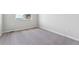 This bedroom features neutral paint and carpet at 457 Interlocken Blvd # 106, Broomfield, CO 80021