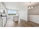 Bright kitchen featuring stainless steel appliances, kitchen island, and views from the large window at 457 Interlocken Blvd # 106, Broomfield, CO 80021