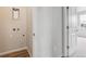 Unfinished laundry room features connections for dryer and washer and has grey wood-style flooring at 457 Interlocken Blvd # 106, Broomfield, CO 80021