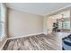 Open-concept living room with hardwood floors, crown molding, and plenty of natural light at 9458 S Hackberry Ln, Highlands Ranch, CO 80129