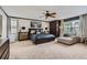 Spacious main bedroom with neutral tones, large windows, and elegant furnishings at 9458 S Hackberry Ln, Highlands Ranch, CO 80129