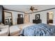 Spacious main bedroom boasts neutral tones, lots of natural light, and ample space for relaxation at 9458 S Hackberry Ln, Highlands Ranch, CO 80129