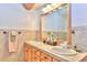 Double vanity bathroom with mirror and tiled countertop at 812 High Point Dr, Breckenridge, CO 80424