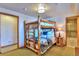 Bedroom featuring a bunk bed, lamp on a table, and a bathroom on the side at 812 High Point Dr, Breckenridge, CO 80424