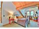 Bedroom featuring rustic accents, natural light, and cozy decor at 812 High Point Dr, Breckenridge, CO 80424