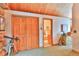 Hallway featuring wood ceiling, closet, and doorway to the bathroom at 812 High Point Dr, Breckenridge, CO 80424
