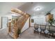 Finished basement area with a kitchenette, bar seating, and staircase at 767 Tenderfoot Dr, Larkspur, CO 80118