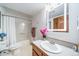 Bright bathroom featuring illuminated mirror and tub/shower combination at 767 Tenderfoot Dr, Larkspur, CO 80118