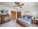 Inviting bedroom features wood accents and a comfortable color palette at 767 Tenderfoot Dr, Larkspur, CO 80118