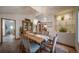 Inviting dining room featuring a wood table, china cabinet, and elegant chandelier at 767 Tenderfoot Dr, Larkspur, CO 80118