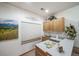 This kitchenette features light wood cabinets, a sink, and a white countertop at 767 Tenderfoot Dr, Larkspur, CO 80118