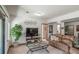Cozy living room with plush seating, a large TV, and natural light at 767 Tenderfoot Dr, Larkspur, CO 80118