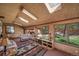 Inviting living room featuring a wood interior, plush seating, and large windows with views at 767 Tenderfoot Dr, Larkspur, CO 80118