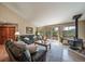 Spacious living room with a wood-burning stove, sliding doors to the deck, and comfortable seating at 767 Tenderfoot Dr, Larkspur, CO 80118