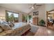 Comfortable bedroom with vaulted ceiling, private deck, and lovely wooded views at 767 Tenderfoot Dr, Larkspur, CO 80118