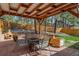 Backyard patio with seating and fire pit, perfect for outdoor enjoyment and entertaining at 767 Tenderfoot Dr, Larkspur, CO 80118